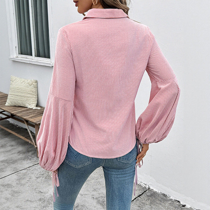 Camicia da donna chic a righe con maniche a lanterna, perfetta per l'ufficio o outfit casual raffinati.