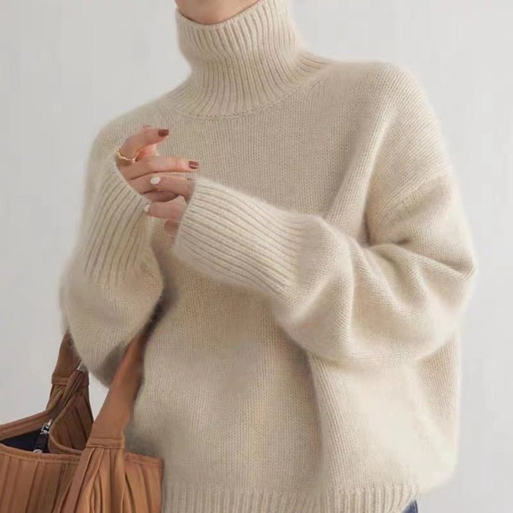 Caldo maglione dolcevita donna a maniche lunghe, perfetto per l'inverno. Look casual ed elegante, massimo comfort.