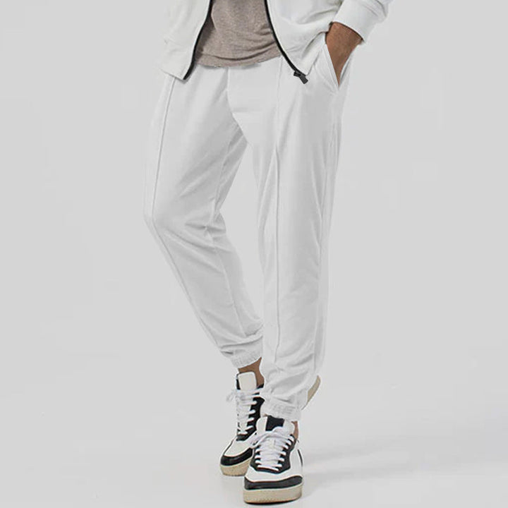 Pantaloni tuta uomo streetwear, vestibilità ampia e gamba affusolata, massimo comfort, vita media.