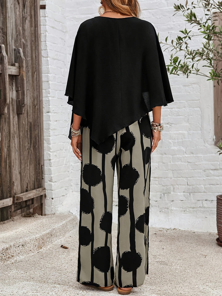 Set donna due pezzi morbido ed elegante, con pantaloni ampi a gamba larga e top asimmetrico. Moda primavera.