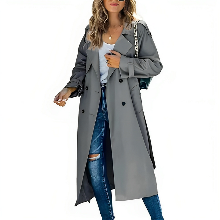 Trench lungo da donna color verde menta, impermeabile e doppiopetto. Outerwear elegante e moderno per la primavera.