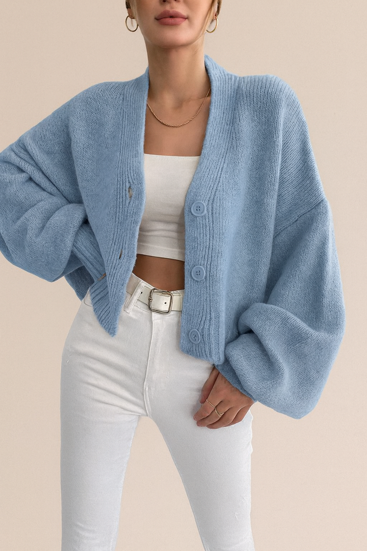 Cardigan donna elegante a maniche a palloncino, corto, versatile per outfit casual o chic.