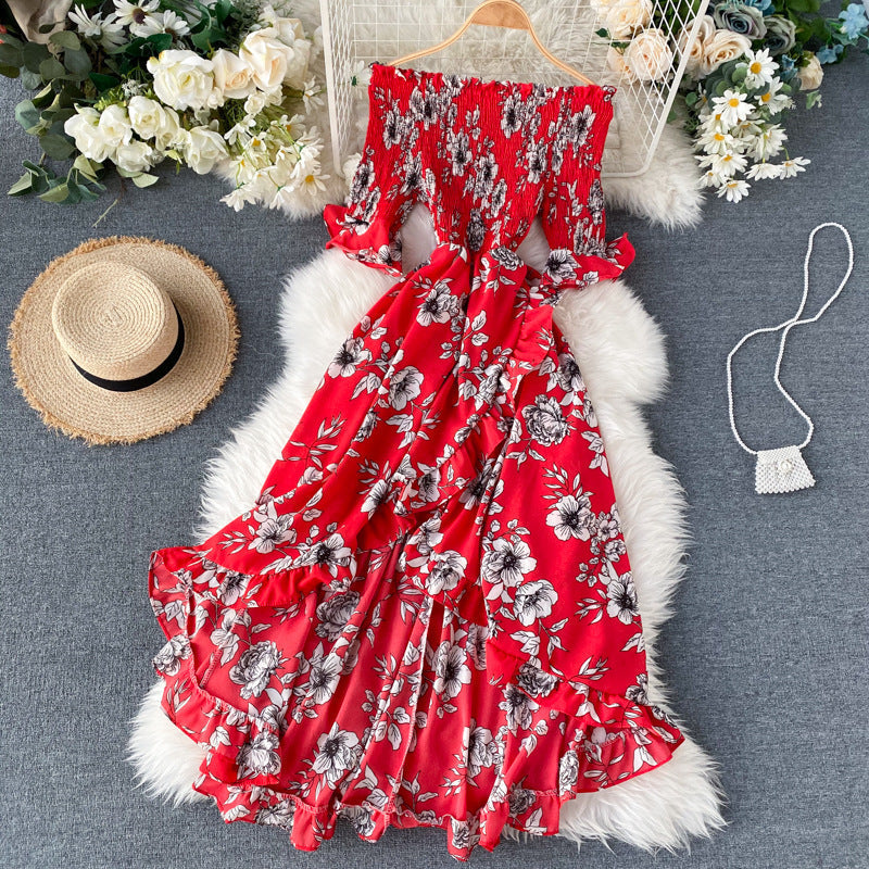 Elegante abito midi estivo con volant e spalle scoperte, ideale per vacanze e serate speciali.