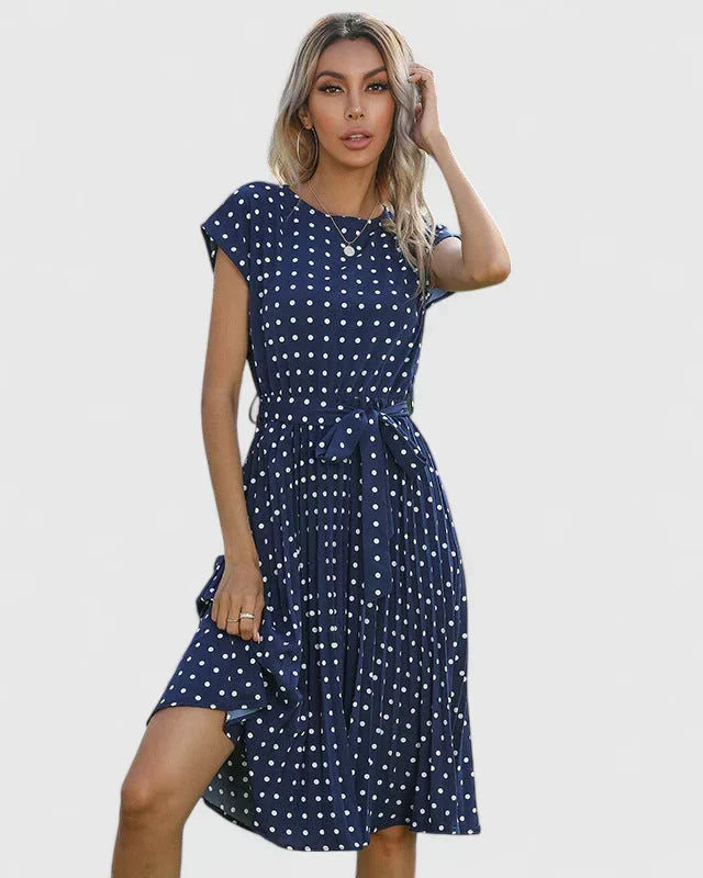 Abito midi donna a pois, vestibilità a trapezio. Ideale per un look chic da ufficio o eventi eleganti.