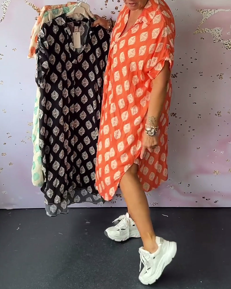 Vestito estivo midi donna con scollo a V, comodo e dai colori vivaci. Perfetto per la moda estiva.
