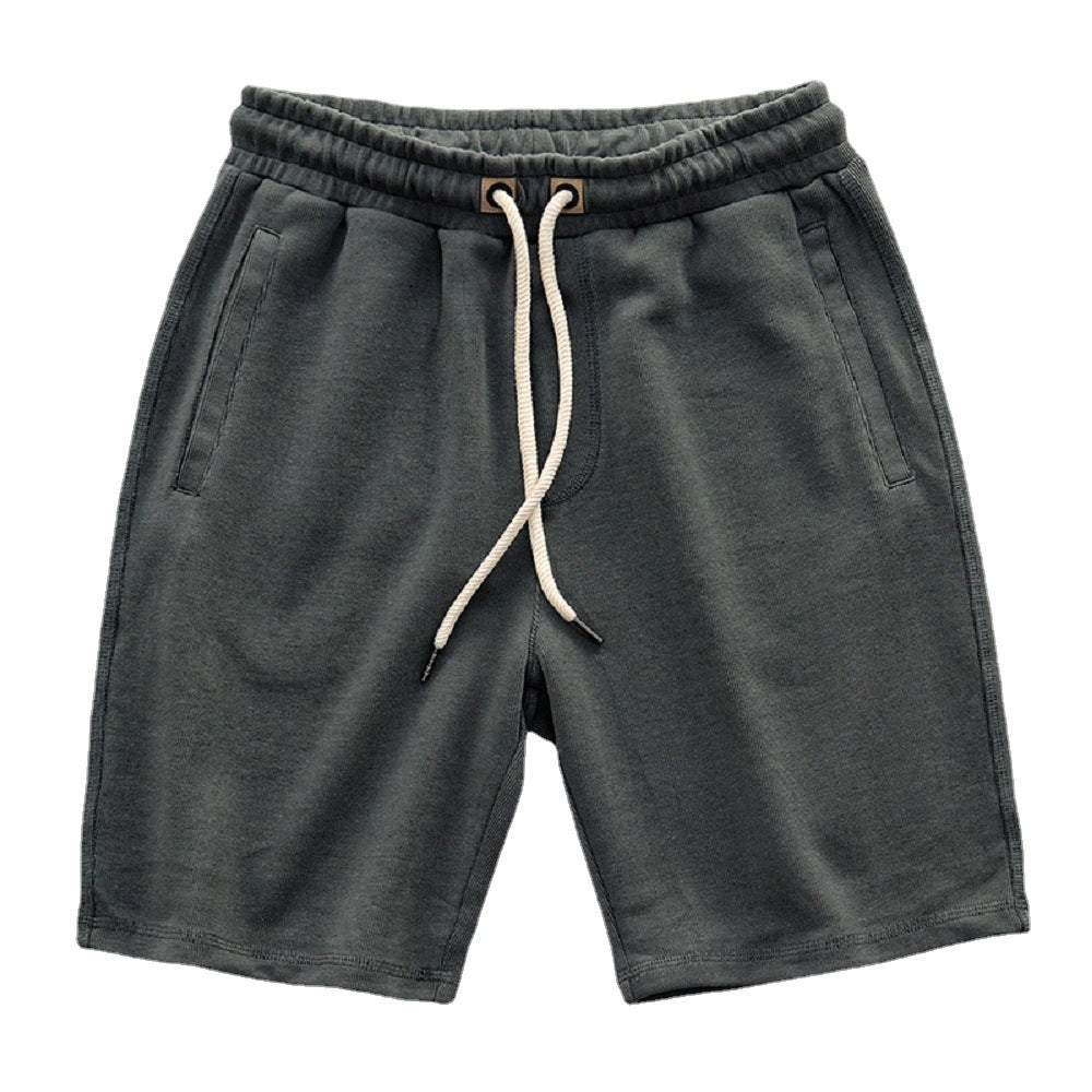 Pantaloncini uomo sportivi con coulisse regolabile, perfetti per l'estate e il tempo libero. Comodità casual.