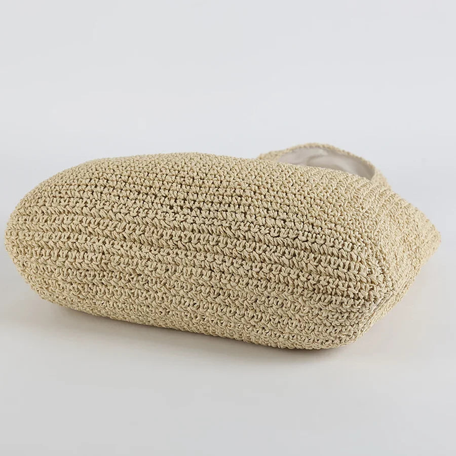 Borsa da spiaggia versatile per donna in paglia, un must-have estivo per giornate al mare e moda.