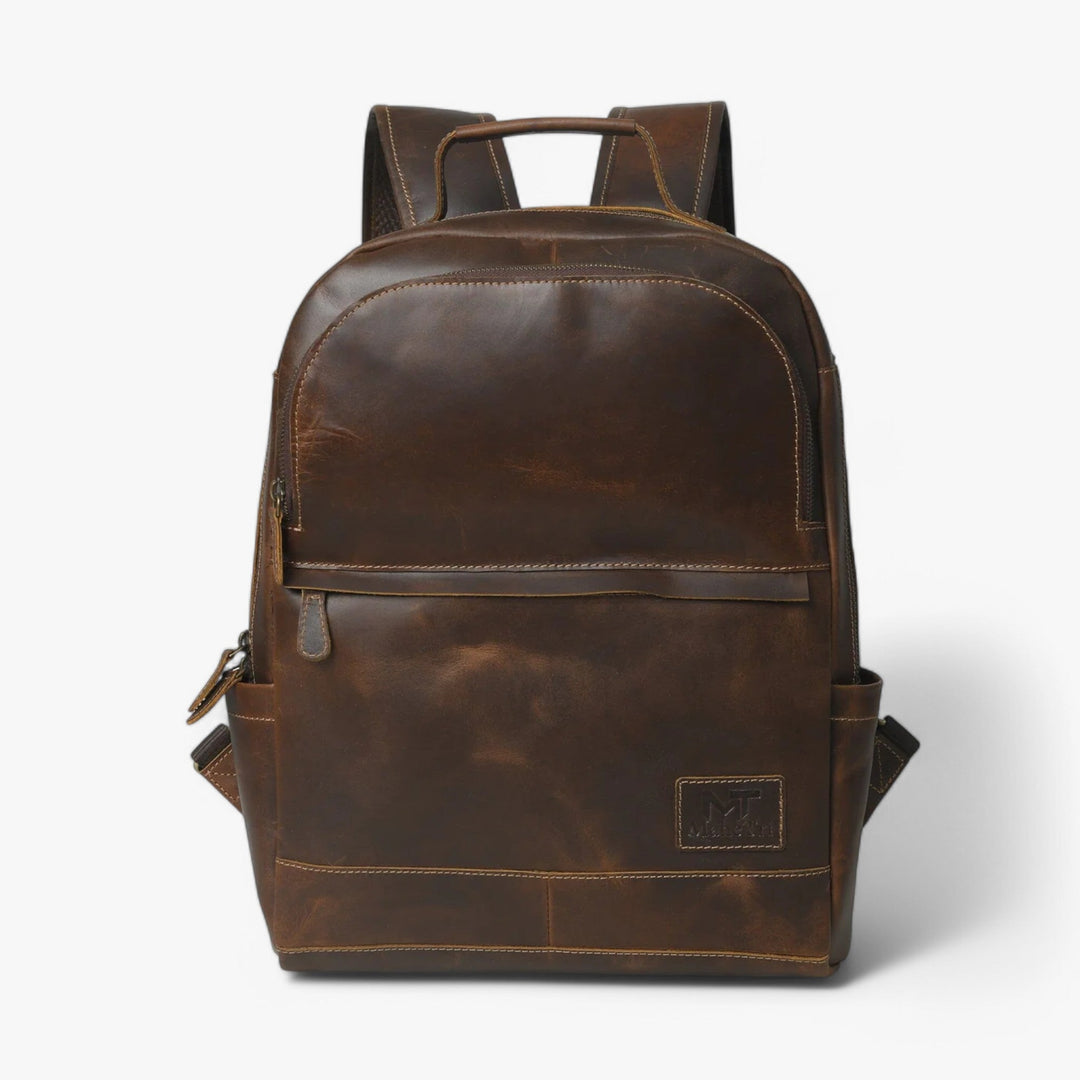 Zaino unisex classico marrone, design minimale per uso quotidiano e viaggio.