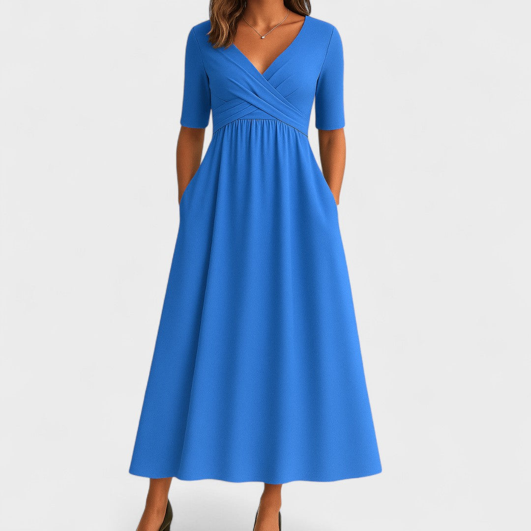 Abito midi estivo donna con scollo incrociato, tasche e gonna svasata. Perfetto per il comfort e stile.