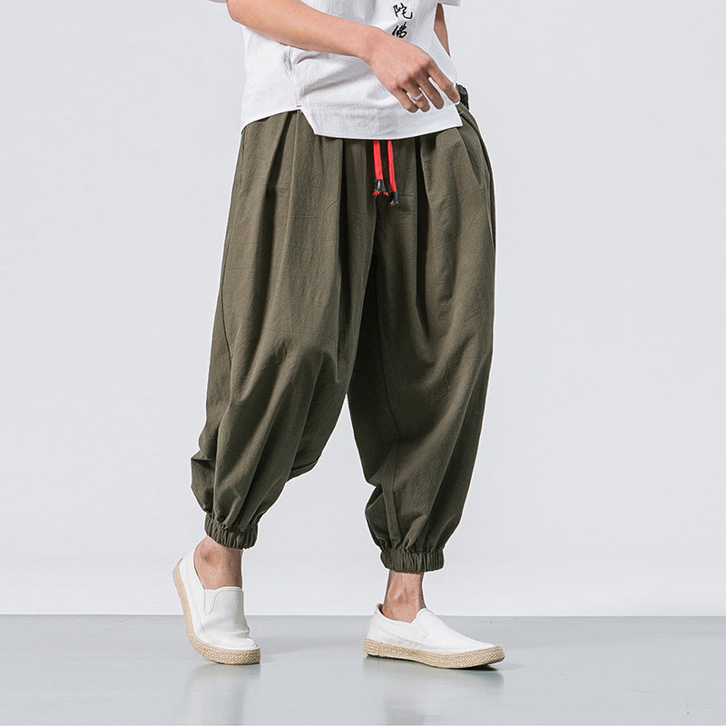 Pantaloni harem uomo casual con vestibilità larga e vita regolabile, ideali per streetwear e comfort quotidiano.