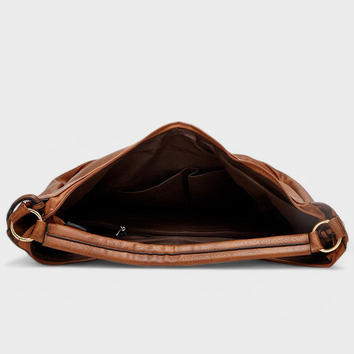 Splendida borsa hobo donna capiente, look bohémien chic, include pratico portafoglio, per outfit di tendenza.