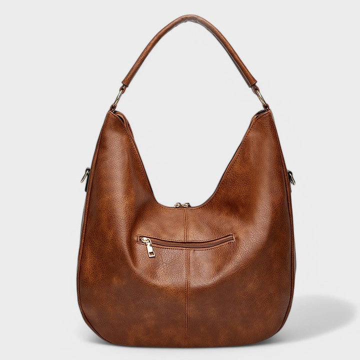 Elegante borsa hobo da donna, design boho chic, ampia e capiente, ideale per l'uso quotidiano con portafoglio.