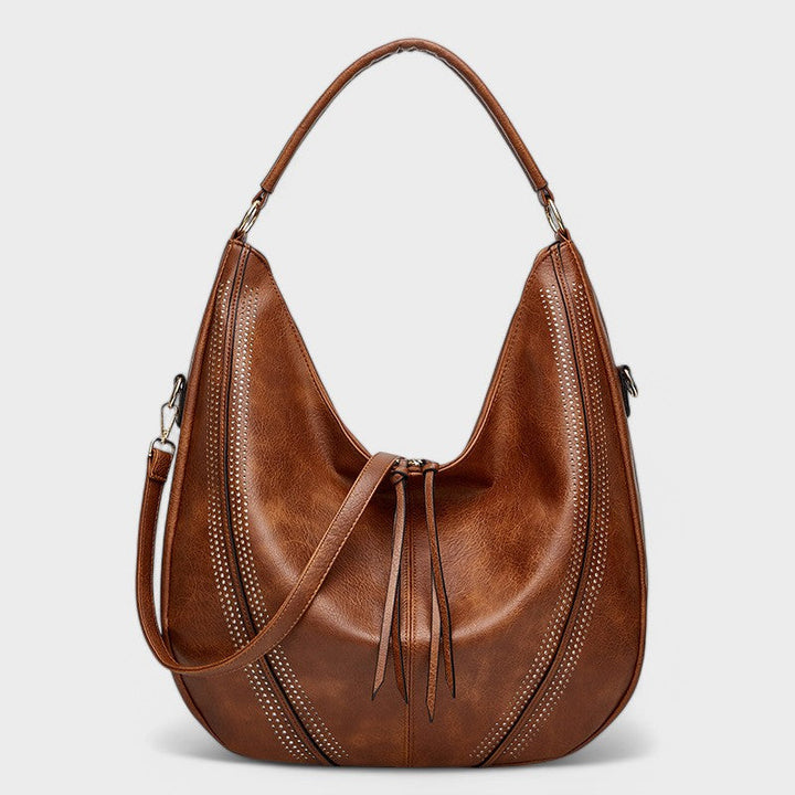 Borsa hobo donna capiente stile boho chic con tracolla, include portafoglio abbinato, perfetta per un look casual.