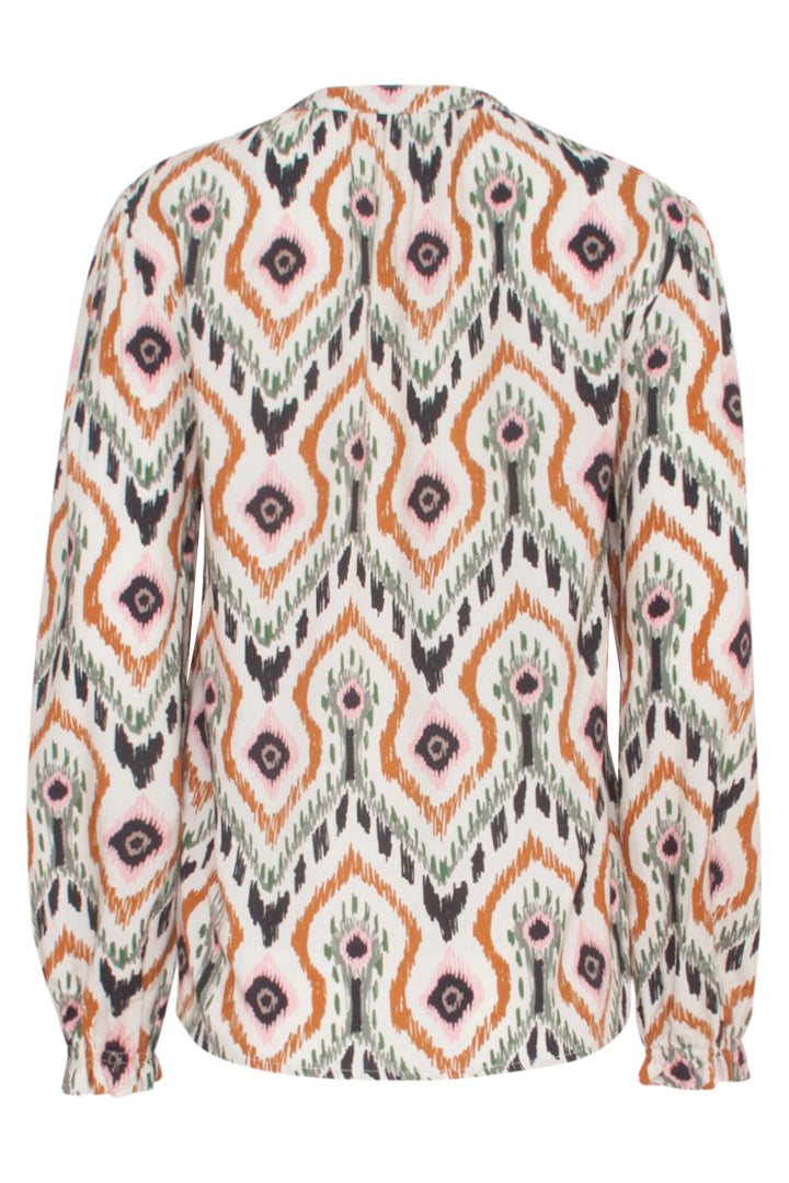 Top donna elegante e casual. Scollo a V, maniche lunghe, stampa tribale. Vestibilità ampia in delicato beige rosato.