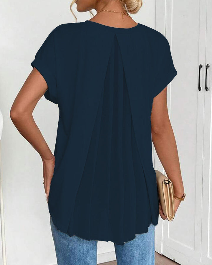 Maglietta donna patchwork con scollo a V profondo e maniche corte, stile moderno e versatile.