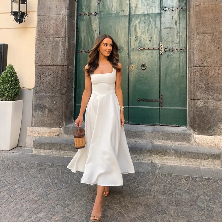 Abito midi donna elegante con scollo quadrato e vita a V, perfetto per serate speciali.