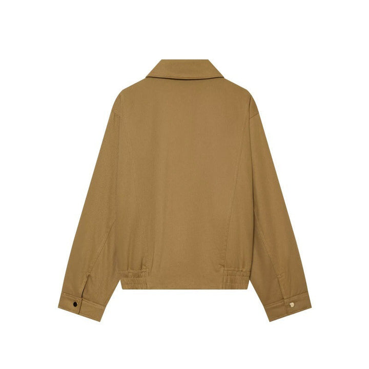 Capospalla donna in cotone, versatile per mezza stagione, con ampi revers e tasche, ideale per un'eleganza quotidiana.