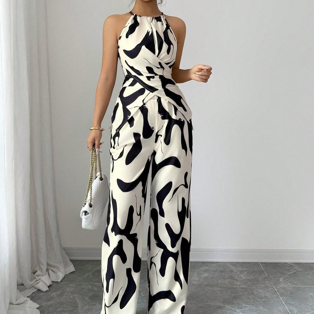 Tuta donna elegante con stampa bicolore, scollo all'americana. Ideale per outfit estivi e serate chic.