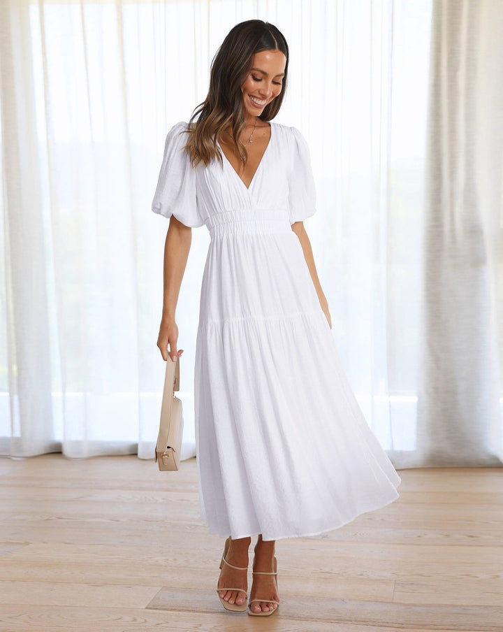 Maxi abito donna estivo con maniche a sbuffo, scollo a V profondo. Un vestito elegante e comodo per l'estate.