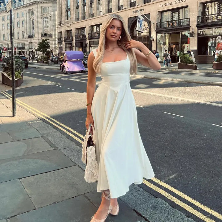 Vestito midi donna alla moda, scollo quadrato e vita a V, look elegante e sofisticato per lei.