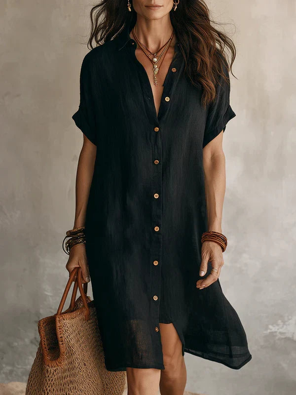 Abito chemise nero da donna, fluido e comodo, con bottoni frontali, ideale per primavera.