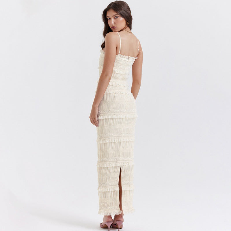 Abito da sera lungo donna bianco avorio con spalline sottili e paillettes, ideale per matrimoni ed eventi.