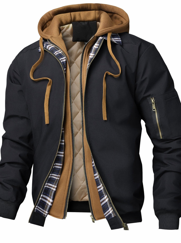 Giacca bomber uomo nera trapuntata con cappuccio, ideale per l'autunno. Stile casual e versatile.
