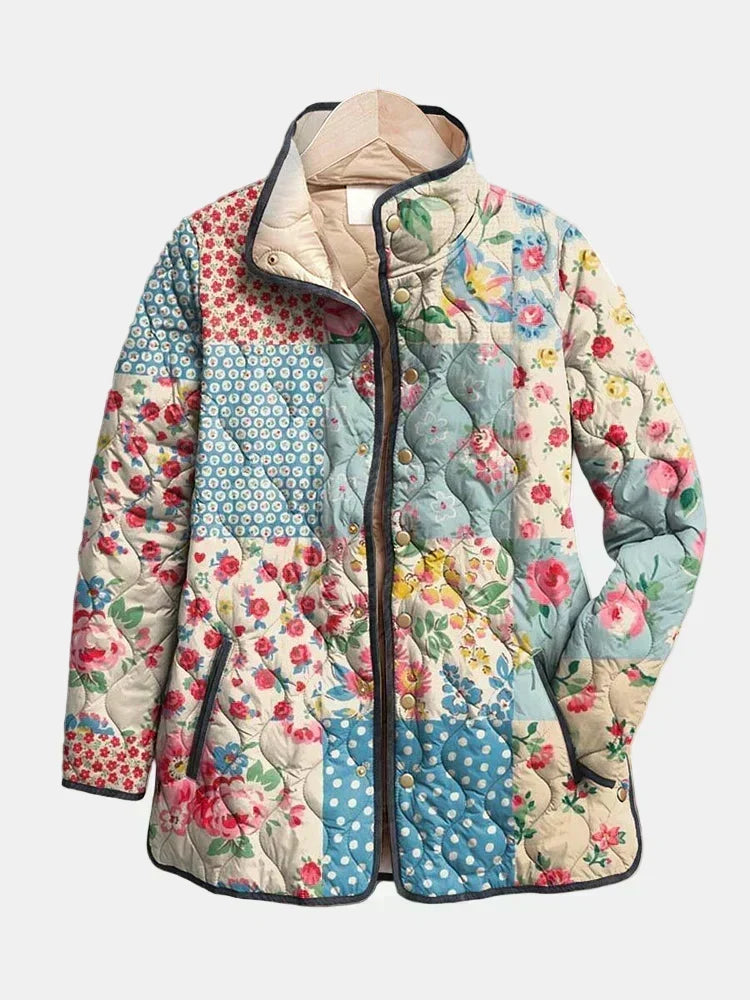 Giacca leggera donna a fantasia floreale, trapuntata, con bottoni per mezza stagione.