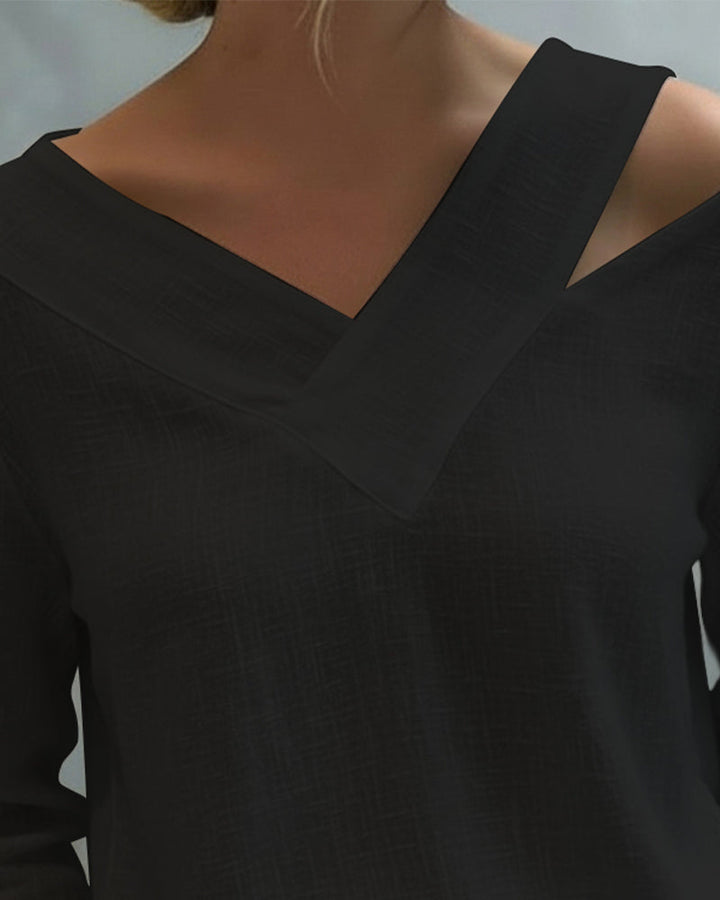 Top donna versatile con scollo a V e orlo asimmetrico, elegante per l'ufficio o per una festa.