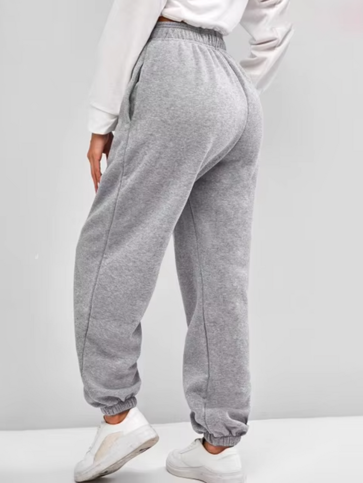 Pantaloni jogger donna sportivi a vita alta, design confortevole e moderno per stile e relax.