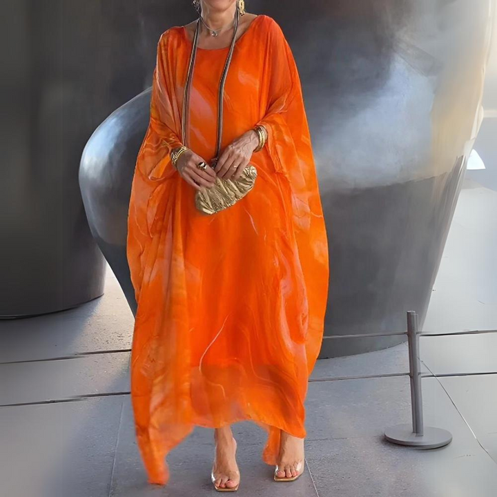 Maxi abito donna in chiffon con silhouette fluida, ideale per eventi speciali e serate.