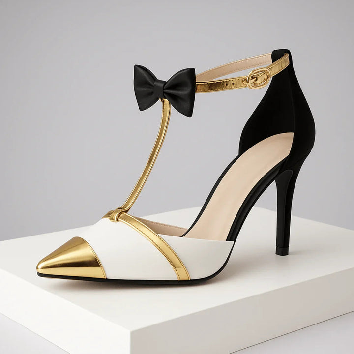 Décolleté donna avorio con cinturino T-bar e fiocco, tacco a stiletto e punta affusolata. Calzature formali.