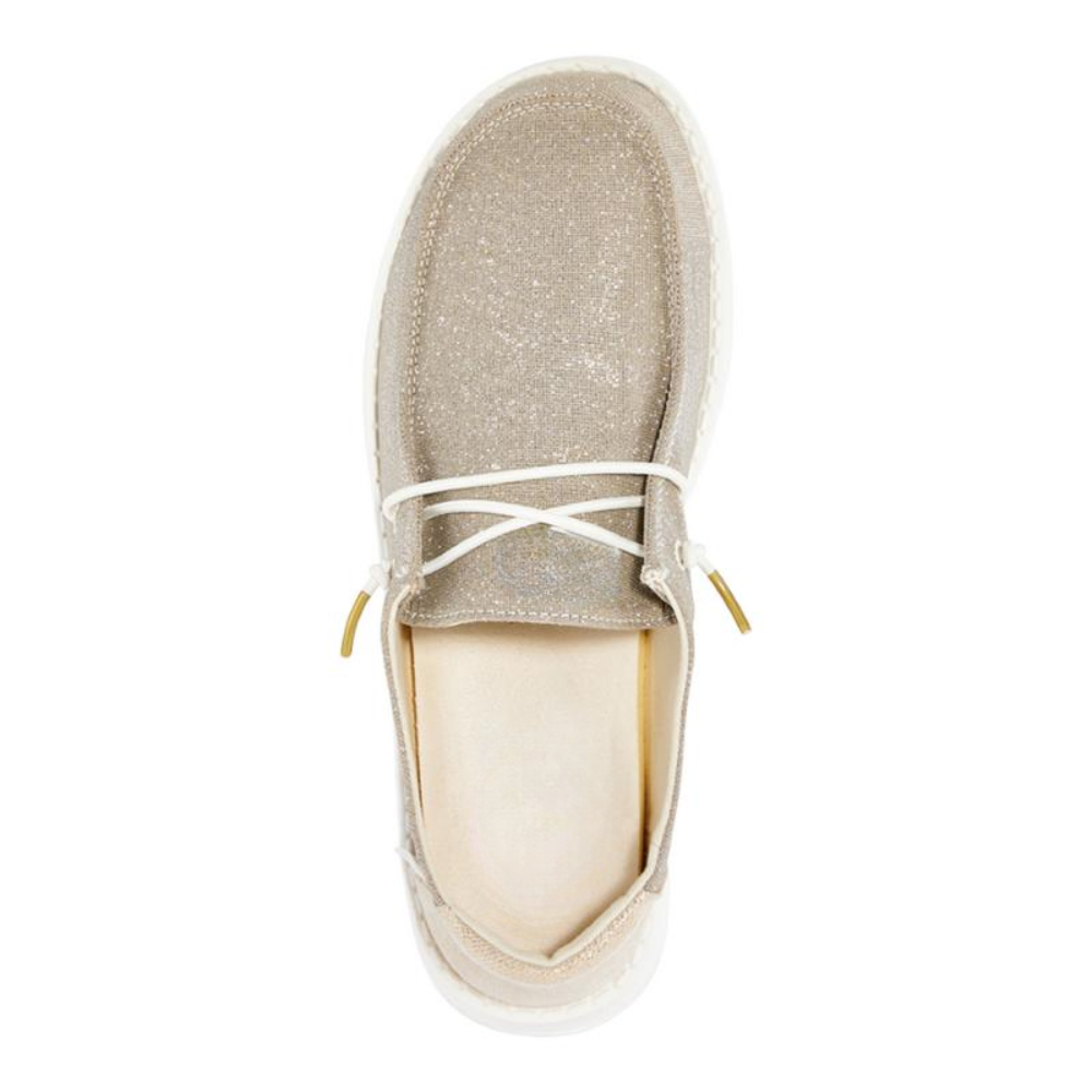 Scarpe slip-on dorate scintillanti da donna, un tocco di lusso per calzature comode e alla moda.