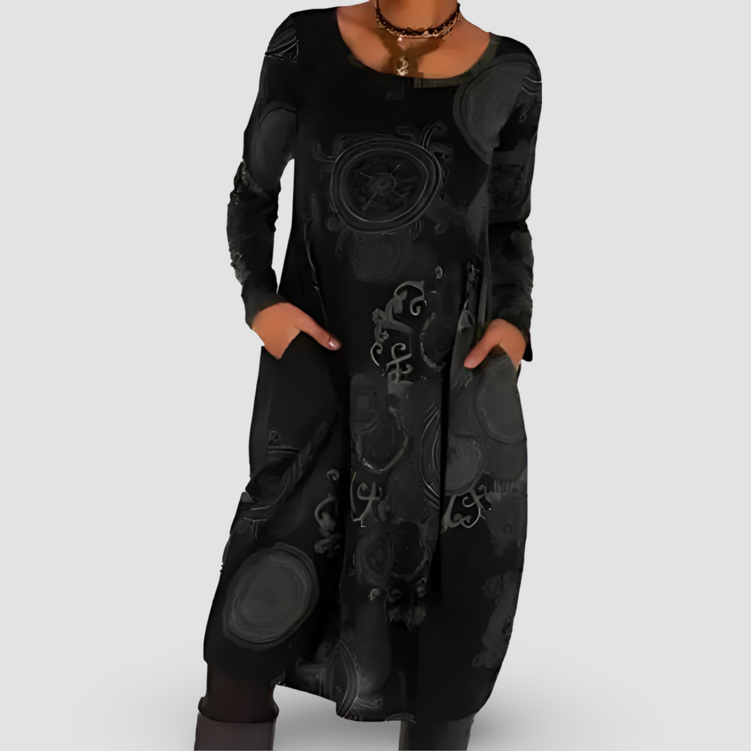 Elegante vestito donna bohemien autunnale con motivi artistici e pratiche tasche. Maxi dress per stile e calore.