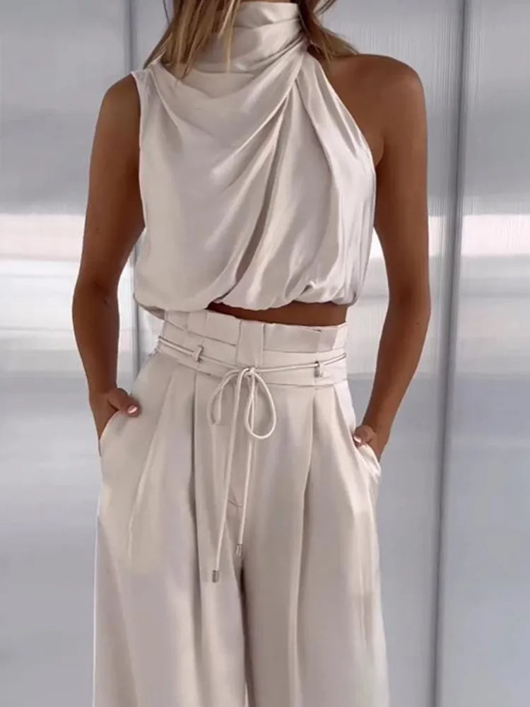 Completo estivo donna elegante: crop top e pantaloni palazzo coordinati. Ideale per un look sofisticato di giorno o sera.