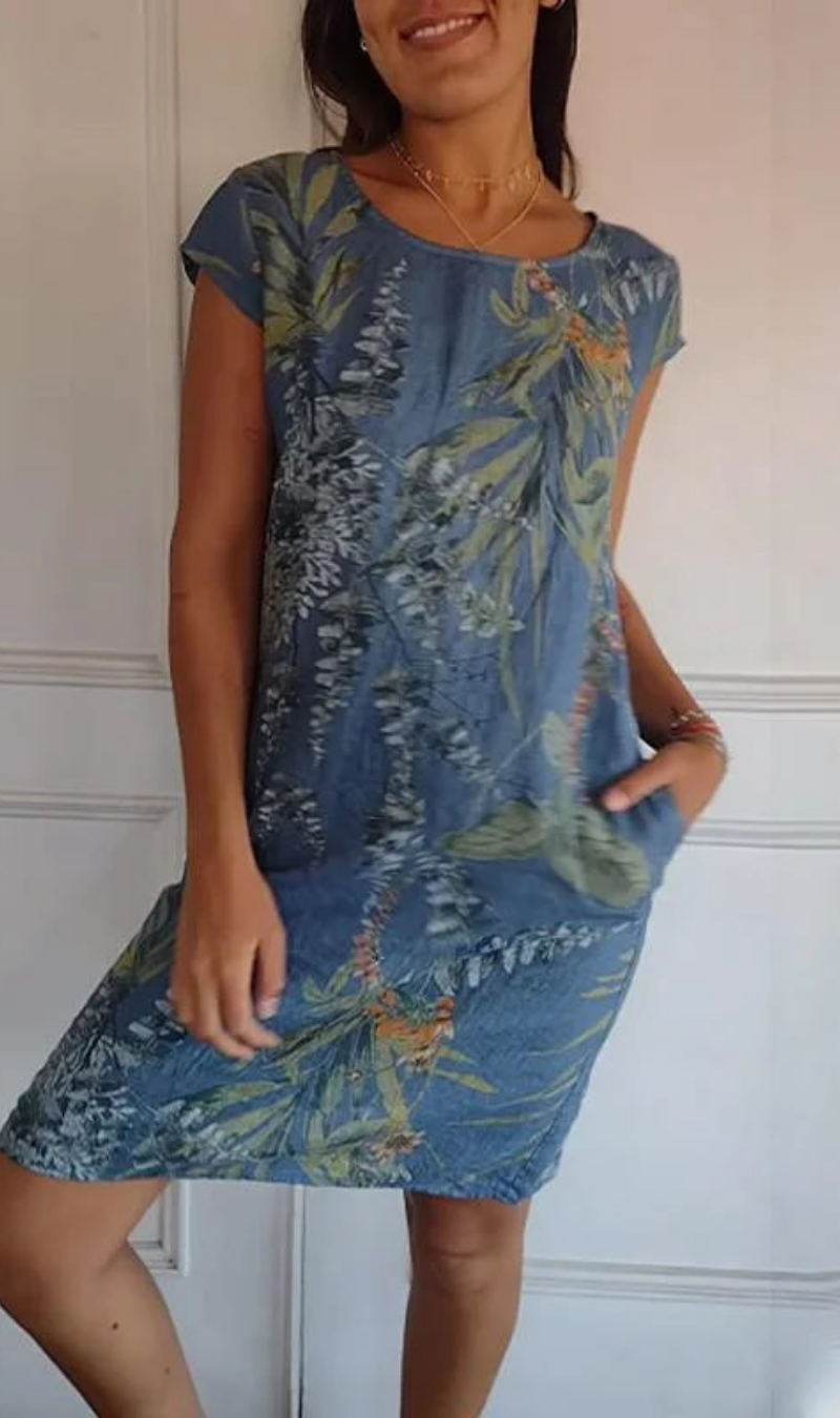 Vestito estivo casual da donna con stampa botanica colorata, perfetto per la primavera.
