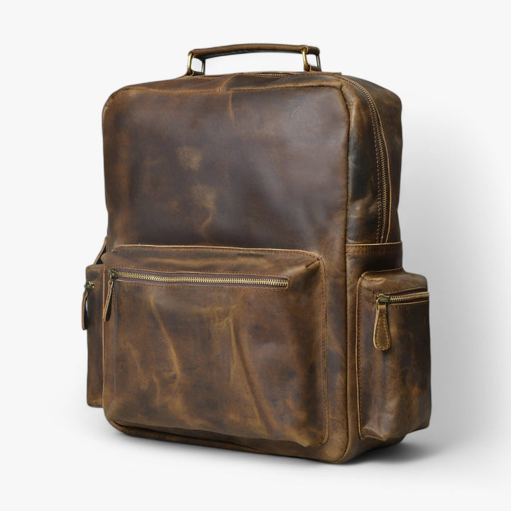 Zaino funzionale marrone per adulto, con diverse tasche per organizzazione quotidiana e viaggio.