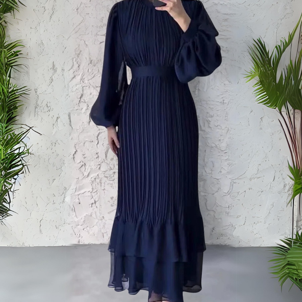 Abito da sera plissettato lungo donna, perfetto per gala, con un design a pieghe elegante e fluido.