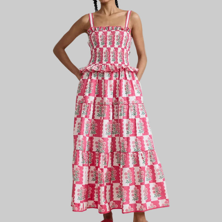 Vivace abito lungo estivo donna floreale, senza spalline, con motivi colorati per look solare e trendy.