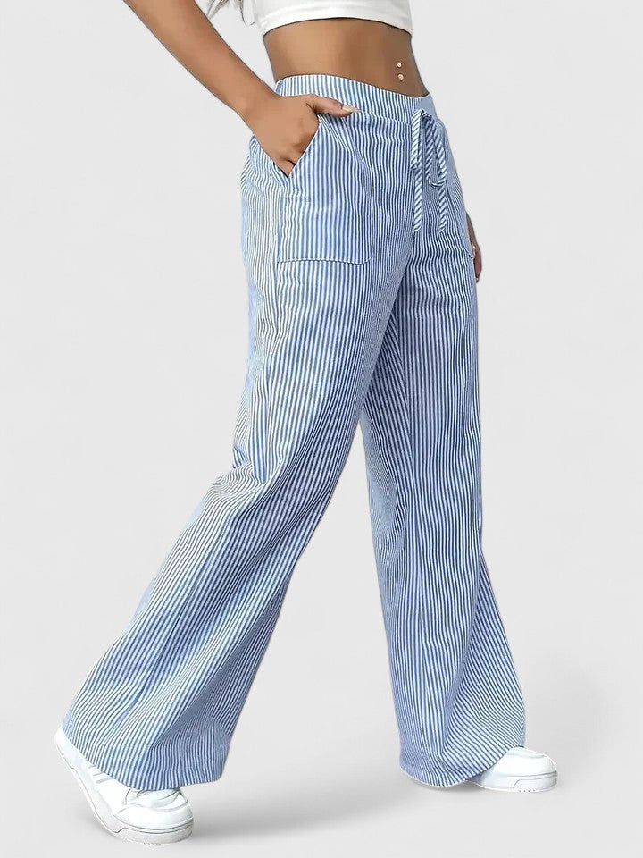 Pantaloni donna a gamba larga e vita alta, con laccio decorativo. Stile elegante e casual estivo.
