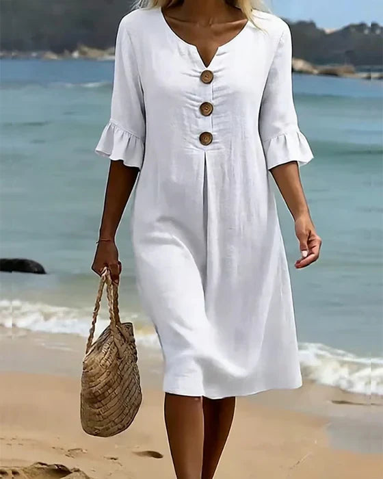 Vestito casual elegante donna in cotone lino, bottoni frontali, perfetto per spiaggia e vacanze estive.