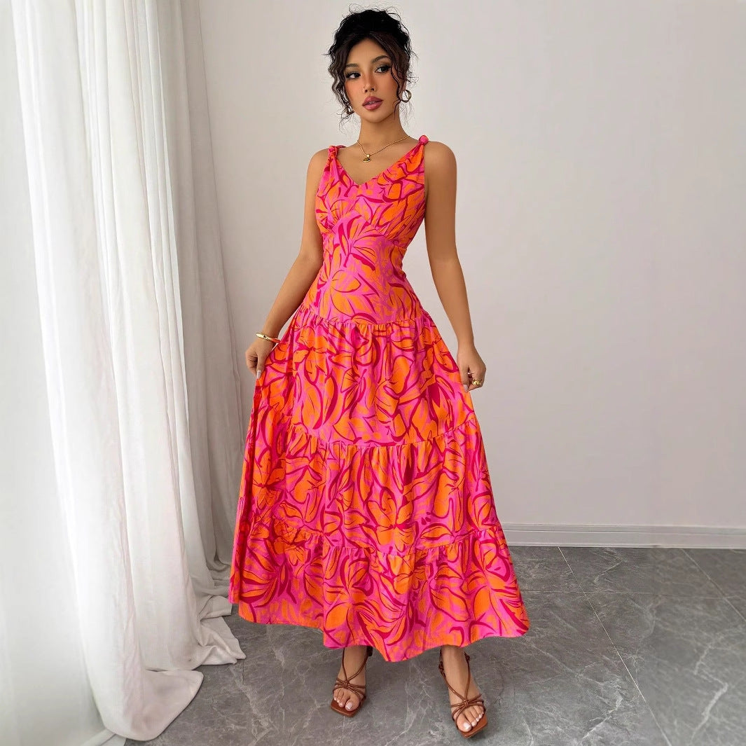 Abito lungo estivo donna senza maniche, stampa tropicale rosa arancio. Perfetto per moda mare e casual.