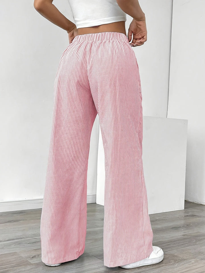 Pantaloni a righe da donna a vita alta, gamba larga, perfetti per abbigliamento estivo e moda mare.