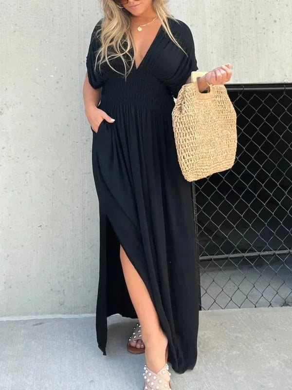 Abito lungo donna elegante nero con scollo a V e spacco laterale. Perfetto per sera e occasioni speciali.