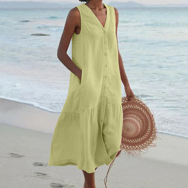Abito midi estivo senza maniche per donna, con tasche laterali e scollo a V. Comodo e versatile.