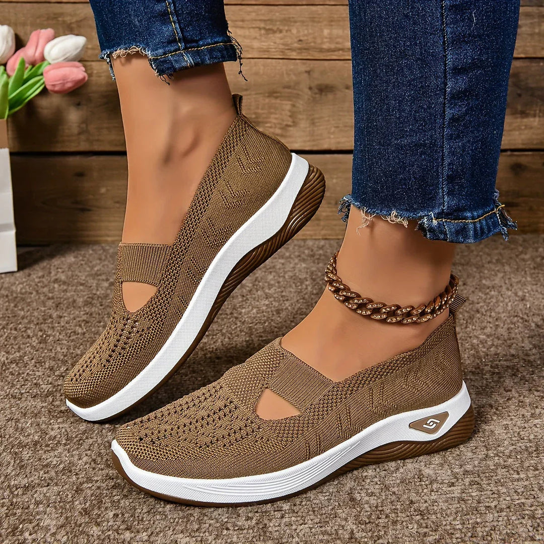 Interno scarpa StrideEase unisex con plantari estraibili per comfort personalizzato e supporto postura.