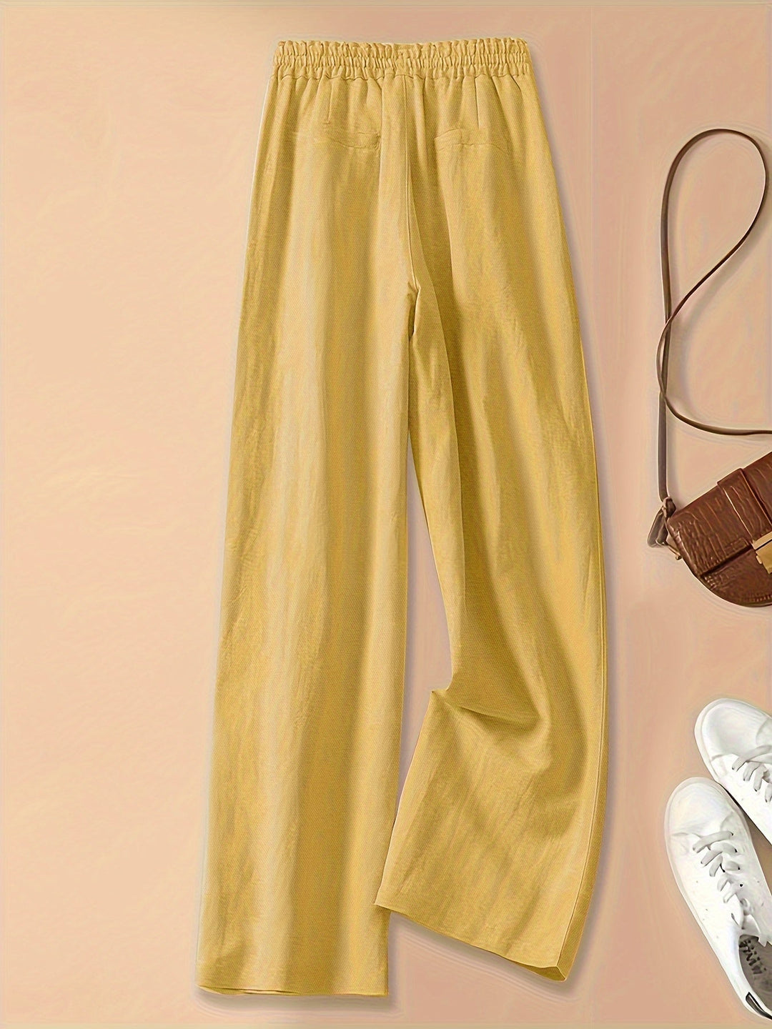 Pantaloni donna a vita alta, stile comodo e relaxed fit, perfetti per il tempo libero e l'estate.