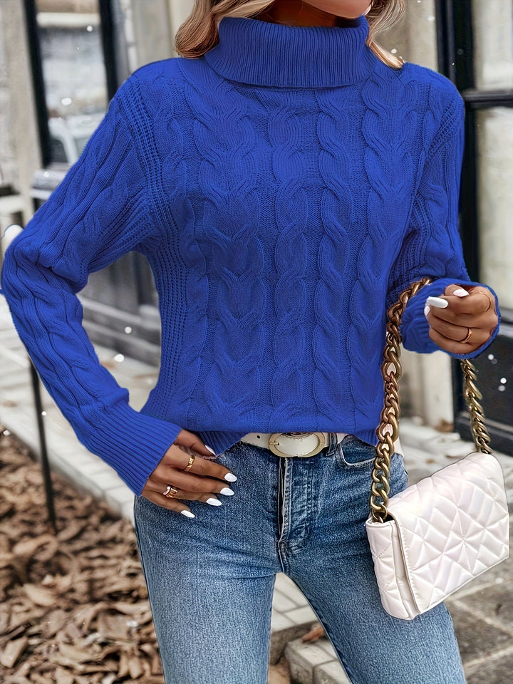 Maglia donna calda per l'inverno, a trecce e con collo alto. Stile senza tempo.