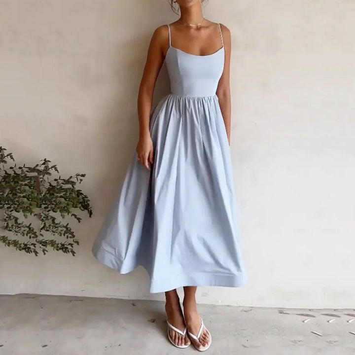 Vestito midi donna estivo con elegante linea A e spalline sottili, perfetto per l'abbigliamento casual e versatile.