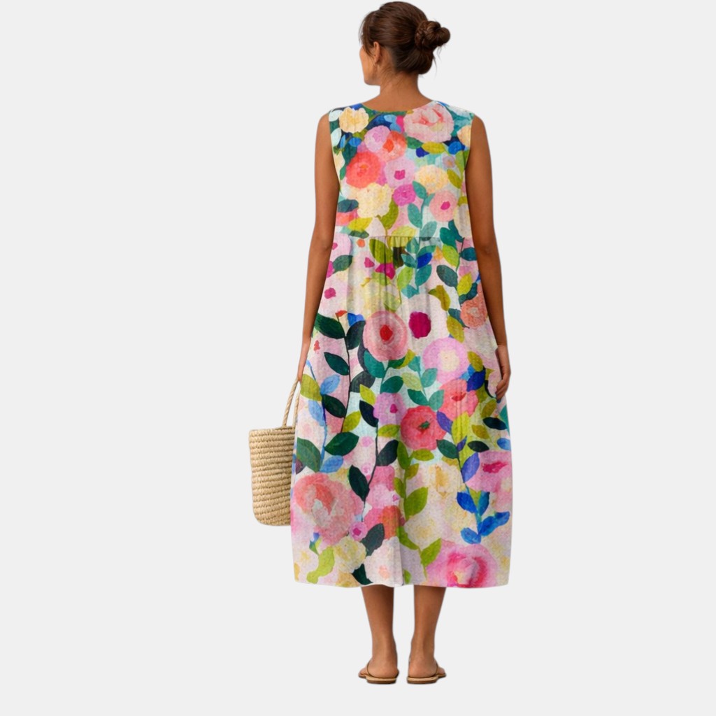 Abito midi donna senza maniche con stampa floreale colorata, per un look primaverile e vacanziero.